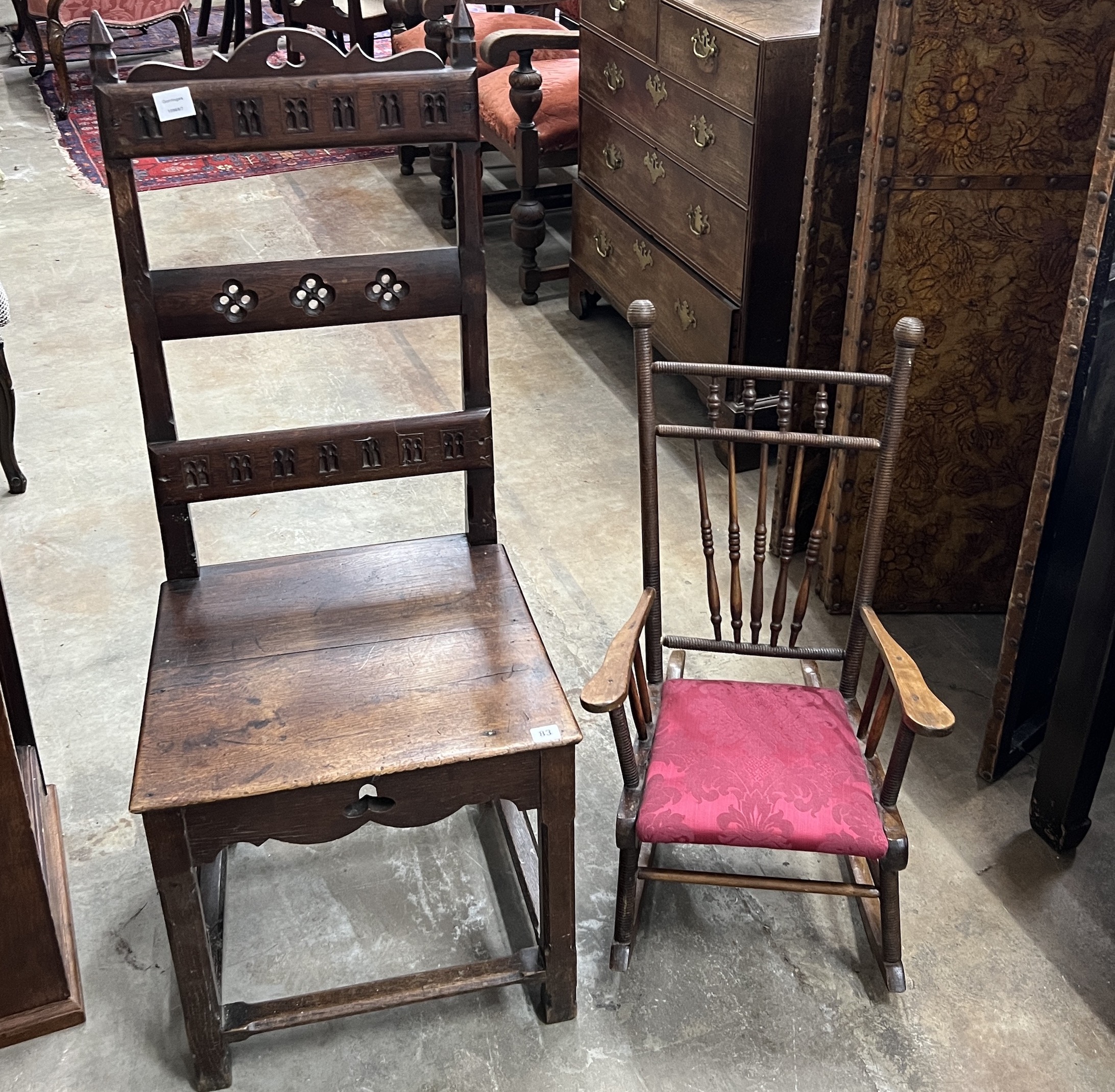 A Victorian carved oak high-back chair, width 49cm, height 118cm together with an early 20th century child's rocking chair